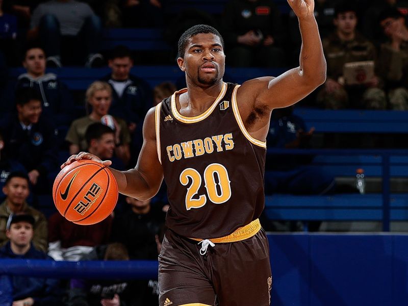 Jan 17, 2023; Colorado Springs, Colorado, USA; Wyoming Cowboys guard Ethan Anderson (20) gestures as he dribbles the ball up court in the first half against the Air Force Falcons at Clune Arena. Mandatory Credit: Isaiah J. Downing-USA TODAY Sports