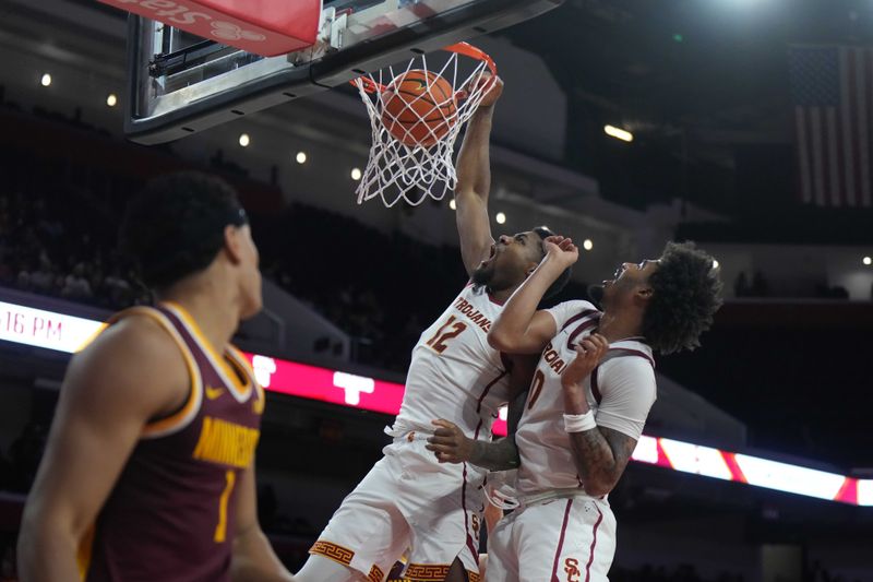 Feb 15, 2025; Los Angeles, California, USA; Southern California Trojans forward Rashaun Agee (12) dunks the ball in the second half against the Minnesota Golden Gophers at the Galen Center. Mandatory Credit: Kirby Lee-Imagn Images