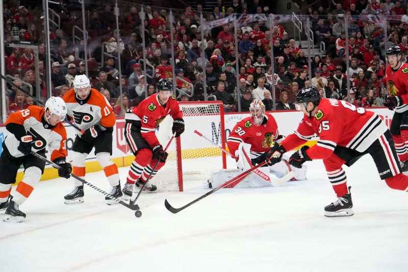 Mar 23, 2025; Chicago, Illinois, USA; Philadelphia Flyers right wing Matvei Michkov (39) and Chicago Blackhawks right wing Ilya Mikheyev (95) go for the puck during the second period at United Center. Mandatory Credit: David Banks-Imagn Images
