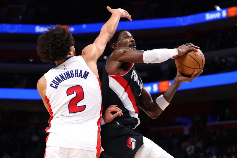 DETROIT, MICHIGAN - JANUARY 06: Deandre Ayton #2 of the Portland Trail Blazers drives to the basket against Cade Cunningham #2 of the Detroit Pistons during the second half at Little Caesars Arena on January 06, 2025 in Detroit, Michigan. Detroit won the game 118-115. NOTE TO USER: User expressly acknowledges and agrees that, by downloading and or using this photograph, User is consenting to the terms and conditions of the Getty Images License. (Photo by Gregory Shamus/Getty Images)