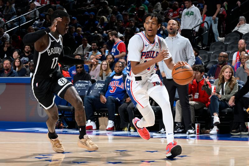 PHILADELPHIA, PA - OCTOBER 16: Jeff Dowtin Jr. #11 of the Philadelphia 76ers dribbles the ball during the game against the Brooklyn Nets on October 16, 2024 at the Wells Fargo Center in Philadelphia, Pennsylvania NOTE TO USER: User expressly acknowledges and agrees that, by downloading and/or using this Photograph, user is consenting to the terms and conditions of the Getty Images License Agreement. Mandatory Copyright Notice: Copyright 2024 NBAE (Photo by David Dow/NBAE via Getty Images)