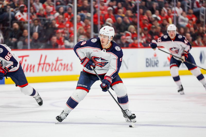 Mar 19, 2024; Detroit, Michigan, USA; Columbus Blue Jackets center Cole Sillinger (4) handles the puck during the third period of the game against the Detroit Red Wings at Little Caesars Arena. Mandatory Credit: Brian Bradshaw Sevald-USA TODAY Sports