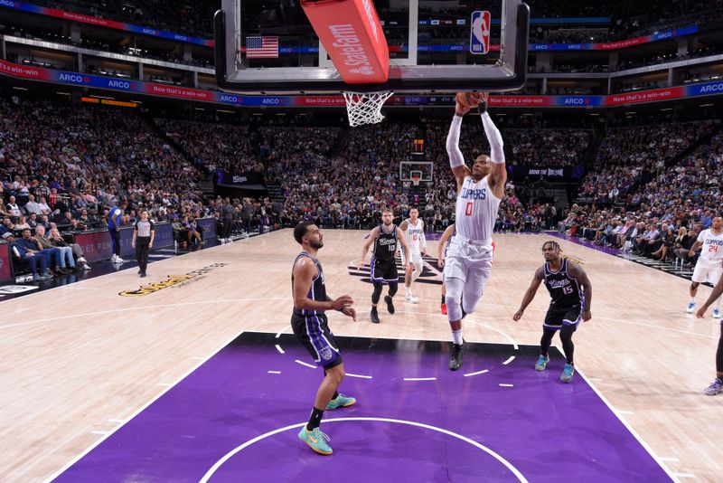 SACRAMENTO, CA - APRIL 2:  Russell Westbrook #0 of the LA Clippers goes to the basket during the game on April 2, 2024 at Golden 1 Center in Sacramento, California. NOTE TO USER: User expressly acknowledges and agrees that, by downloading and or using this Photograph, user is consenting to the terms and conditions of the Getty Images License Agreement. Mandatory Copyright Notice: Copyright 2024 NBAE (Photo by Rocky Widner/NBAE via Getty Images)