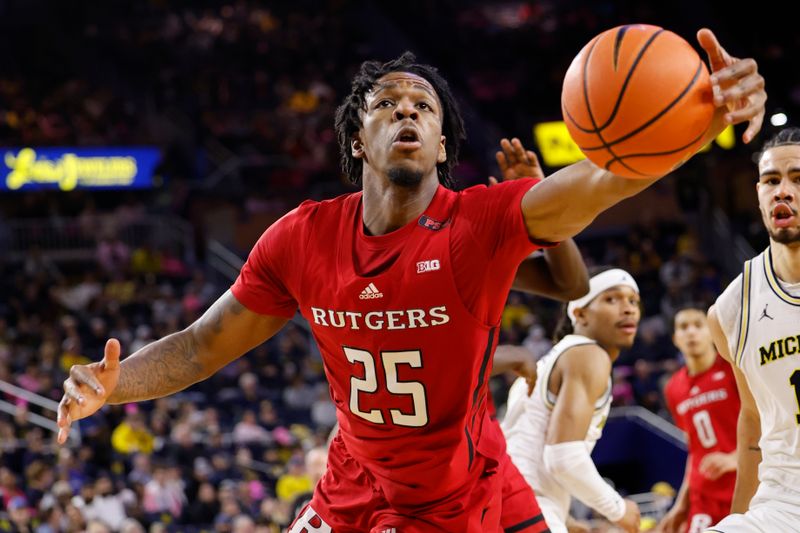 Feb 3, 2024; Ann Arbor, Michigan, USA;  Rutgers Scarlet Knights guard Jeremiah Williams (25) grabs the rebound in the second half against the Michigan Wolverines at Crisler Center. Mandatory Credit: Rick Osentoski-USA TODAY Sports