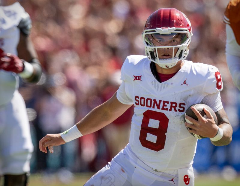 Oct 7, 2023; Dallas, Texas, USA; Oklahoma Sooners quarterback Dillon Gabriel (8) runs for a first down against the Texas Longhorns during the first half at the Cotton Bowl. Mandatory Credit: Jerome Miron-USA TODAY Sports