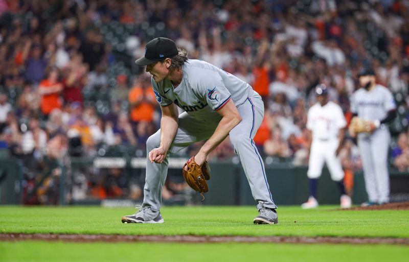 Jul 10, 2024; Houston, Texas, USA; Miami Marlins relief pitcher Declan Cronin (51) reacts after commiting a throwing error during the fourth inning against the Houston Astros at Minute Maid Park. Mandatory Credit: Troy Taormina-USA TODAY Sports