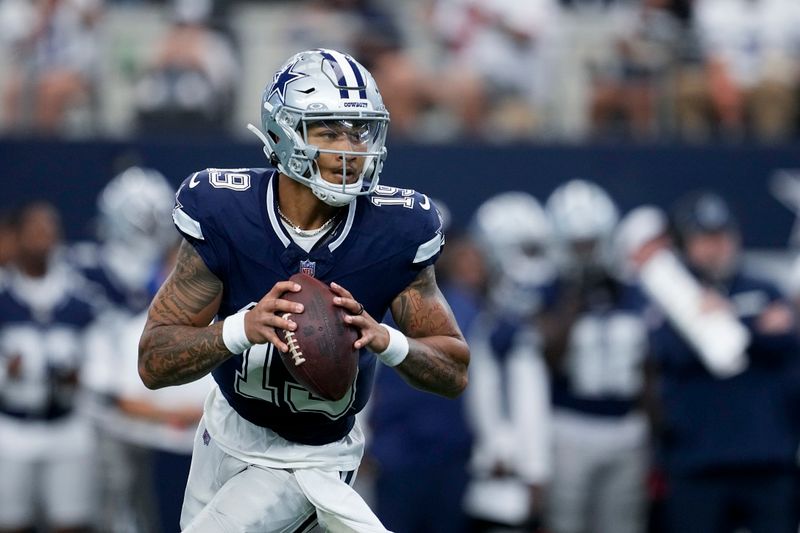 Dallas Cowboys quarterback Trey Lance rolls out of the pocket during the first half of a preseason NFL football game against the Los Angeles Chargers, Saturday, Aug. 24, 2024, in Arlington, Texas.(AP Photo/Tony Gutierrez )