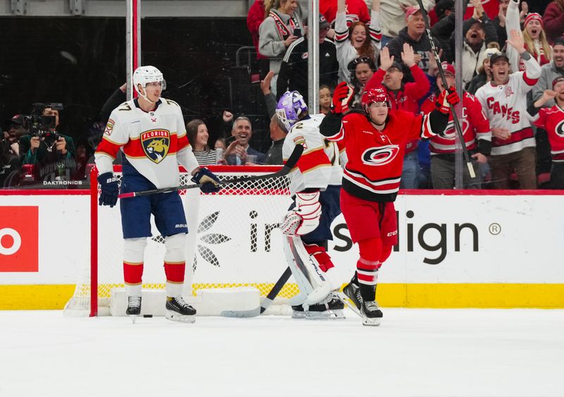 Nov 29, 2024; Raleigh, North Carolina, USA;  Carolina Hurricanes left wing Eric Robinson (50) celebrates his goal against the Florida Panthers during the second period at Lenovo Center. Mandatory Credit: James Guillory-Imagn Images