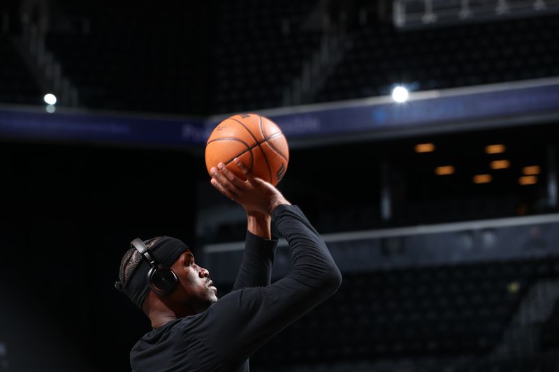 BROOKLYN, NY - JANUARY 15: Jimmy Butler #22 of the Miami Heat shoots the ball before the game against the Brooklyn Nets on January 15, 2024 at Barclays Center in Brooklyn, New York. NOTE TO USER: User expressly acknowledges and agrees that, by downloading and or using this Photograph, user is consenting to the terms and conditions of the Getty Images License Agreement. Mandatory Copyright Notice: Copyright 2024 NBAE (Photo by David Nemec/NBAE via Getty Images)