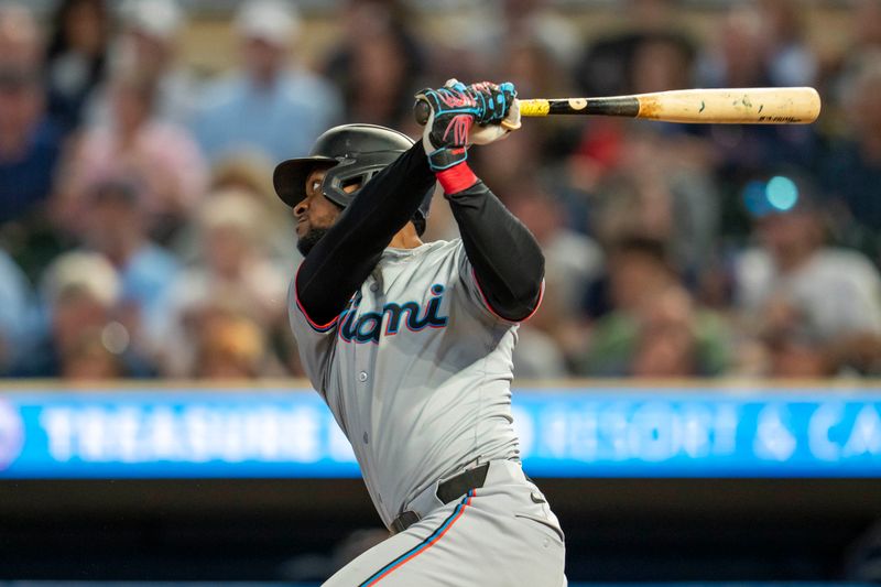 Sep 25, 2024; Minneapolis, Minnesota, USA; Miami Marlins second baseman Otto Lopez (61) hits a single against the Minnesota Twins in the third inning at Target Field. Mandatory Credit: Jesse Johnson-Imagn Images