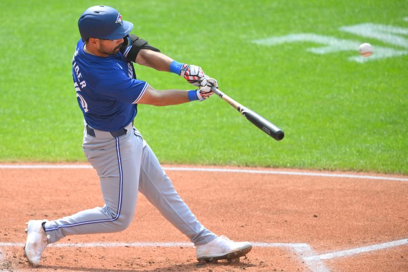 Jun 22, 2024; Cleveland, Ohio, USA; Toronto Blue Jays second baseman Davis Schneider (36) hits a solo home run in the second inning against the Cleveland Guardians at Progressive Field. Mandatory Credit: David Richard-USA TODAY Sports