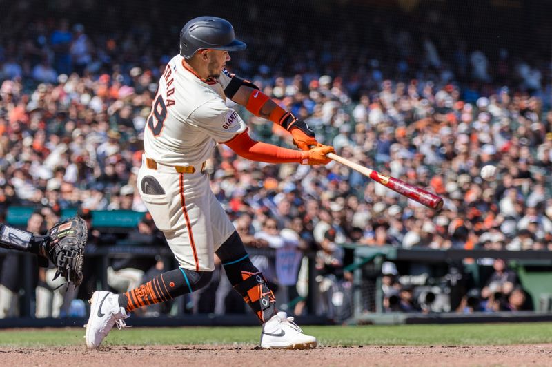 Apr 21, 2024; San Francisco, California, USA;  San Francisco Giants second baseman Thairo Estrada (39) hits a double against the Arizona Diamondbacks during the ninth inning at Oracle Park. Mandatory Credit: John Hefti-USA TODAY Sports