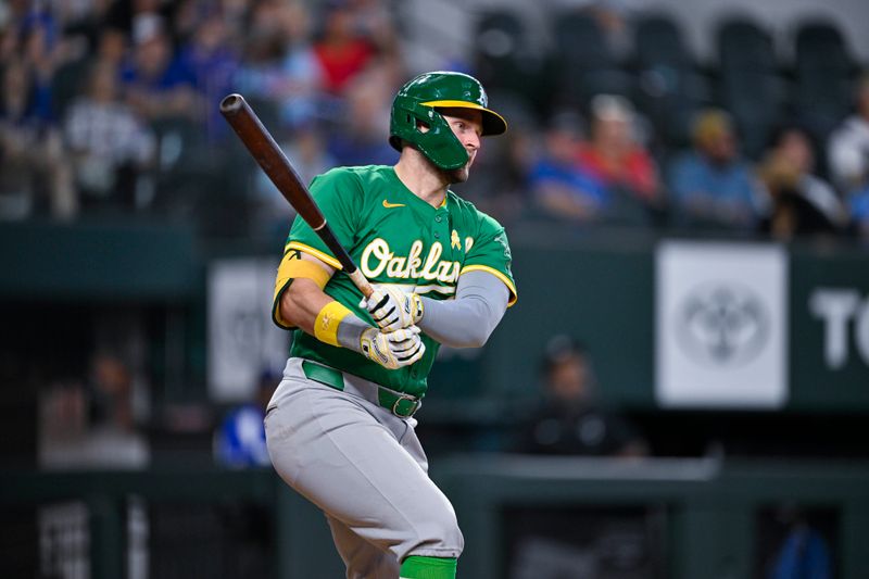 Sep 1, 2024; Arlington, Texas, USA; Oakland Athletics left fielder Seth Brown (15) hits a triple against the Texas Rangers during the tenth inning at Globe Life Field. Mandatory Credit: Jerome Miron-USA TODAY Sports