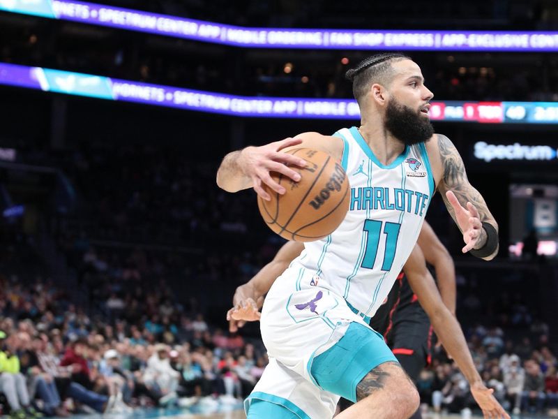 CHARLOTTE, NC - FEBRUARY 7:  Cody Martin #11 of the Charlotte Hornets drives to the basket during the game against the Toronto Raptors on February 7, 2024 at Spectrum Center in Charlotte, North Carolina. NOTE TO USER: User expressly acknowledges and agrees that, by downloading and or using this photograph, User is consenting to the terms and conditions of the Getty Images License Agreement.  Mandatory Copyright Notice:  Copyright 2024 NBAE (Photo by Brock Williams-Smith/NBAE via Getty Images)