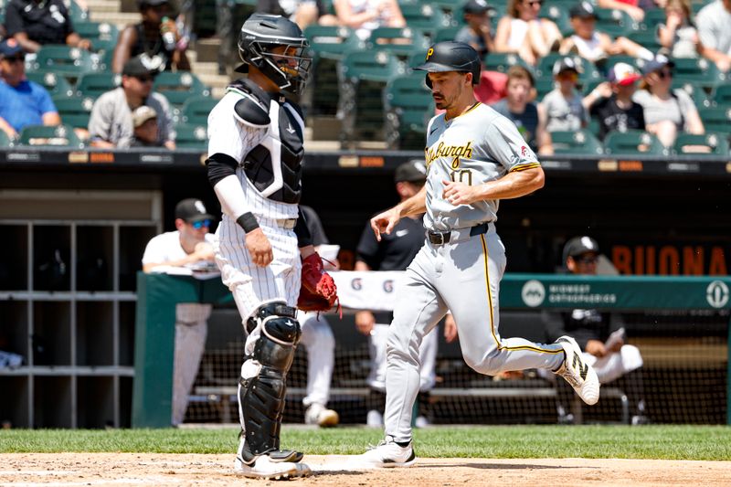 Jul 14, 2024; Chicago, Illinois, USA; Pittsburgh Pirates outfielder Bryan Reynolds (10) scores against the Chicago White Sox during the third inning at Guaranteed Rate Field. Mandatory Credit: Kamil Krzaczynski-USA TODAY Sports