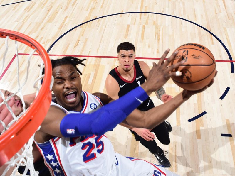 DENVER, CO - JANUARY 27: Danuel House Jr. #25 of the Philadelphia 76ers drives to the basket during the game against the Denver Nuggets on January 27, 2024 at the Ball Arena in Denver, Colorado. NOTE TO USER: User expressly acknowledges and agrees that, by downloading and/or using this Photograph, user is consenting to the terms and conditions of the Getty Images License Agreement. Mandatory Copyright Notice: Copyright 2024 NBAE (Photo by Garrett Ellwood/NBAE via Getty Images)