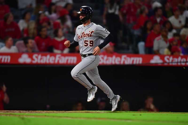 Sep 15, 2023; Anaheim, California, USA; Detroit Tigers second baseman Zack Short (59) runs home to score against the Los Angeles Angels during the ninth inning at Angel Stadium. Mandatory Credit: Gary A. Vasquez-USA TODAY Sports