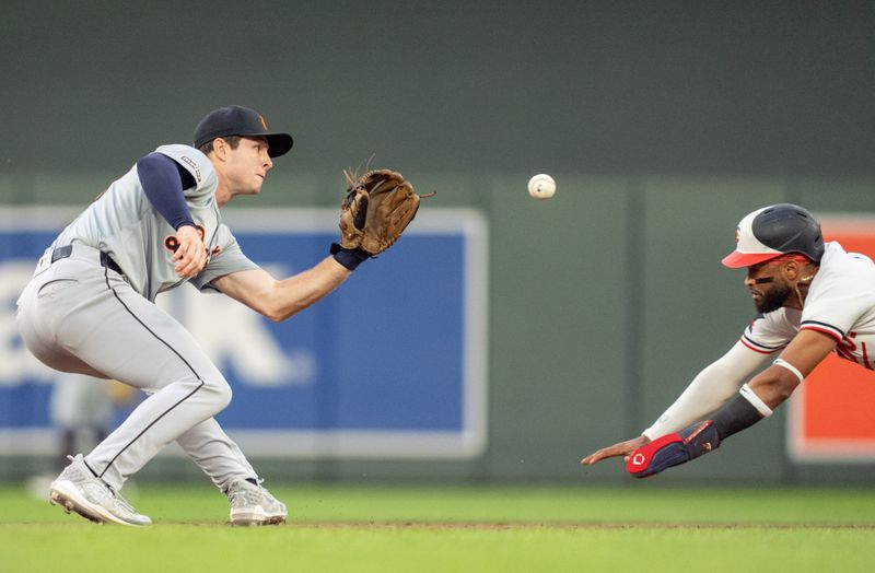 Jul 2, 2024; Minneapolis, Minnesota, USA; Detroit Tigers second base Colt Keith (33) receives the throw from center fielder Riley Greene (31) and tags out Minnesota Twins left fielder Willi Castro (50) trying to steal second in the seventh inning at Target Field. Mandatory Credit: Matt Blewett-USA TODAY Sports