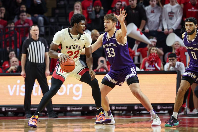 Feb 15, 2024; Piscataway, New Jersey, USA; Rutgers Scarlet Knights center Emmanuel Ogbole (22) dribbles against Northwestern Wildcats forward Luke Hunger (33)  during the first half at Jersey Mike's Arena. Mandatory Credit: Vincent Carchietta-USA TODAY Sports