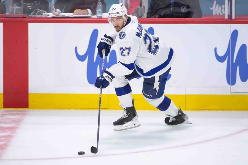 Oct 19, 2024; Ottawa, Ontario, CAN; Tampa Bay Lightning defenseman Ryan McDonagh (27) skates with the puck in the third period against the Ottawa Senators at the Canadian Tire Centre. Mandatory Credit: Marc DesRosiers-Imagn Images