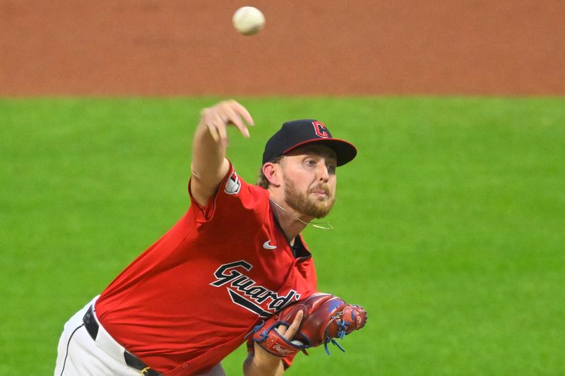 Sep 24, 2024; Cleveland, Ohio, USA; Cleveland Guardians starting pitcher Tanner Bibee (28) pitches in the second inning against the Cincinnati Reds at Progressive Field. Mandatory Credit: David Richard-Imagn Images