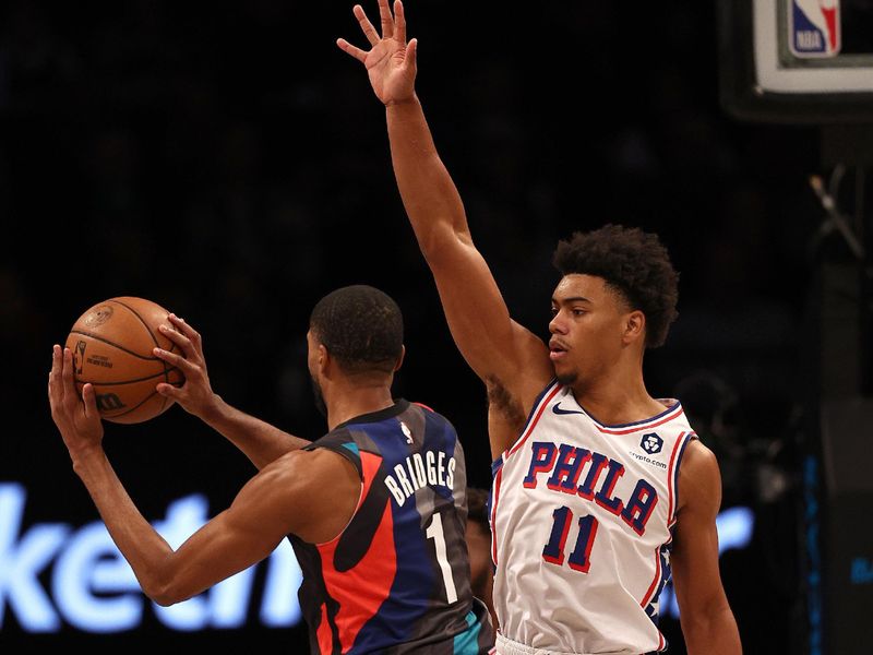NEW YORK, NEW YORK - NOVEMBER 19:  Mikal Bridges #1 of the Brooklyn Nets heads for the net as Jaden Springer #11 of the Philadelphia 76ers defends at Barclays Center on November 19, 2023 in the Brooklyn borough of New York City. The Philadelphia 76ers defeated the Brooklyn Nets 121-99. NOTE TO USER: User expressly acknowledges and agrees that, by downloading and or using this photograph, User is consenting to the terms and conditions of the Getty Images License Agreement. (Photo by Elsa/Getty Images)