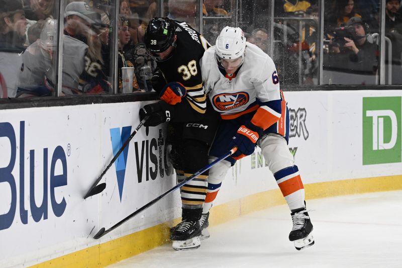 Nov 9, 2023; Boston, Massachusetts, USA; New York Islanders defenseman Ryan Pulock (6) checks Boston Bruins center Patrick Brown (38) during the third period at the TD Garden. Mandatory Credit: Brian Fluharty-USA TODAY Sports