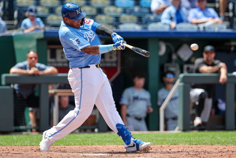 Jun 26, 2024; Kansas City, Missouri, USA; Kansas City Royals catcher Salvador Perez (13) hits a two RBI double against the Miami Marlins during the eighth inning at Kauffman Stadium. Mandatory Credit: William Purnell-USA TODAY Sports