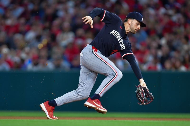 Apr 27, 2024; Anaheim, California, USA; Minnesota Twins second baseman Edouard Julien (47) fields the ground ball of Los Angeles Angels third baseman Luis Rengifo (2) during the third inning at Angel Stadium. Mandatory Credit: Gary A. Vasquez-USA TODAY Sports