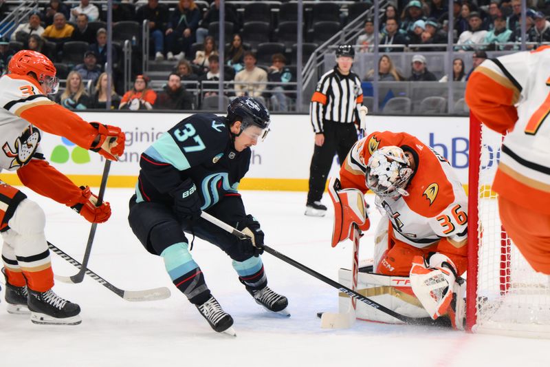 Nov 27, 2024; Seattle, Washington, USA; Seattle Kraken center Yanni Gourde (37) shot on goal is blocked by Anaheim Ducks goaltender John Gibson (36) during the first period at Climate Pledge Arena. Mandatory Credit: Steven Bisig-Imagn Images