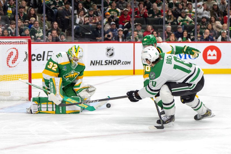 Nov 16, 2024; Saint Paul, Minnesota, USA; Minnesota Wild goaltender Filip Gustavsson (32) stops a shot by Dallas Stars center Oskar Back (10) as Minnesota enter Marcus Johansson (90) assists in the second period at Xcel Energy Center. Mandatory Credit: Matt Blewett-Imagn Images