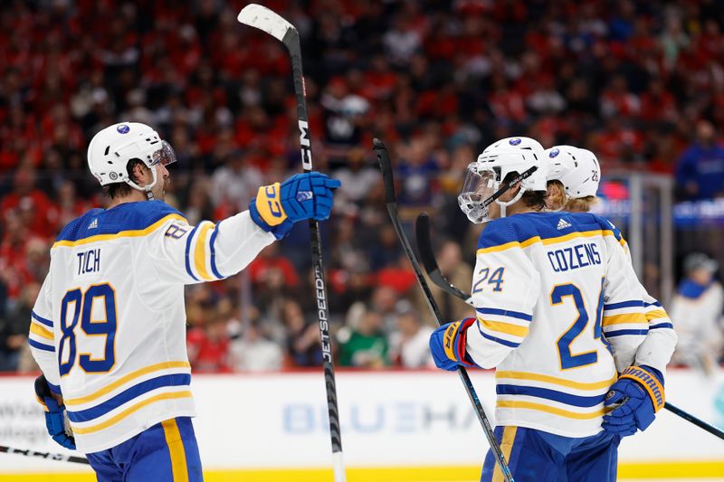 Nov 22, 2023; Washington, District of Columbia, USA; Buffalo Sabres center Dylan Cozens (24) celebrates with teammates after scoring a goal against the Washington Capitals in the second period at Capital One Arena. Mandatory Credit: Geoff Burke-USA TODAY Sports