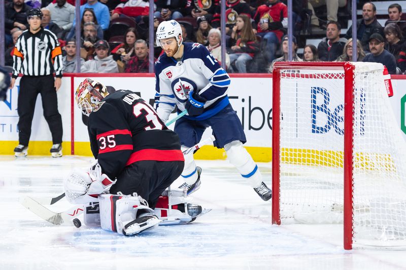 Feb 26, 2025; Ottawa, Ontario, CAN; Ottawa Senators goalie Linus Ullmark (35) makes a save in front of Winnipeg Jets center Gabriel Vilardi (13) at the Canadian Tire Centre. Mandatory Credit: Marc DesRosiers-Imagn Images