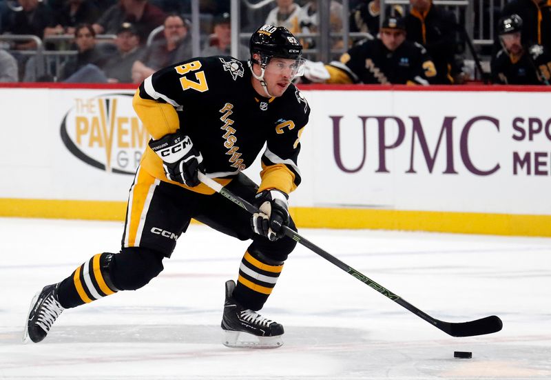 Mar 14, 2024; Pittsburgh, Pennsylvania, USA; Pittsburgh Penguins center Sidney Crosby (87) moves the puck up ice against the San Jose Sharks during the first period at PPG Paints Arena. Mandatory Credit: Charles LeClaire-USA TODAY Sports