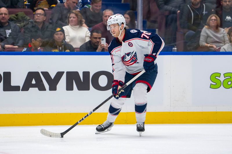 Dec 6, 2024; Vancouver, British Columbia, CAN; Columbus Blue Jackets defenseman Damon Severson (78) handles the puck against the Vancouver Canucks during the first period at Rogers Arena. Mandatory Credit: Bob Frid-Imagn Images