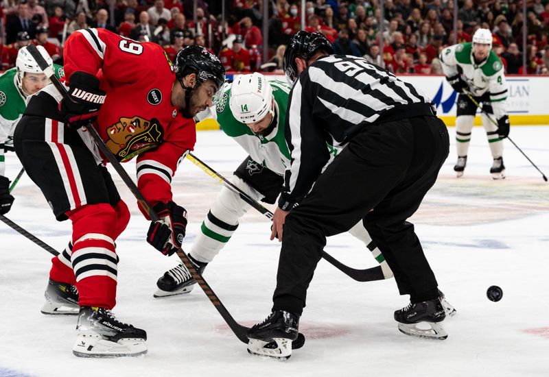 Apr 6, 2024; Chicago, Illinois, USA; Chicago Blackhawks center Andreas Athanasiou (89) faces off with Dallas Stars left winger Jamie Benn (14) during the third period at United Center. Mandatory Credit: Seeger Gray-USA TODAY Sports