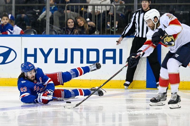 Mar 29, 2026; New York, New York, USA; New York Rangers center Mika Zibanejad (93) attempts to play the puck from the ice defended by Florida Panthers defenseman Aaron Ekblad (5) during the third period at Madison Square Garden. Mandatory Credit: Dennis Schneidler-Imagn Images Mar 29, 2026; New York, New York, USA; New York Rangers center Mika Zibanejad (93) attempts to play the puck from the ice defended by Florida Panthers defenseman Aaron Ekblad (5) during the third period at Madison Square Garden. Mandatory Credit: Dennis Schneidler-Imagn Images