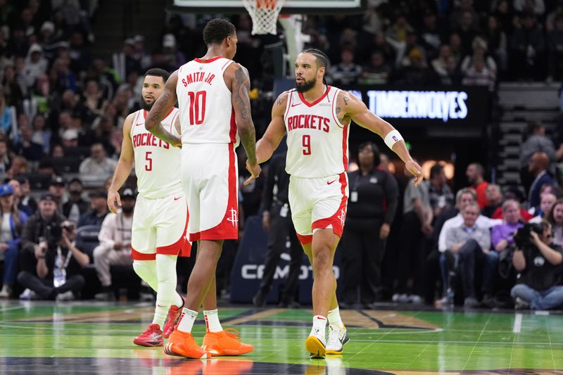 MINNEAPOLIS, MN -  NOVEMBER 26: Jabari Smith Jr. #10 and Dillon Brooks #9 of the Houston Rockets high five during the game against the Minnesota Timberwolves during the Emirates NBA Cup game on November 26, 2024 at Target Center in Minneapolis, Minnesota. NOTE TO USER: User expressly acknowledges and agrees that, by downloading and or using this Photograph, user is consenting to the terms and conditions of the Getty Images License Agreement. Mandatory Copyright Notice: Copyright 2024 NBAE (Photo by Jordan Johnson/NBAE via Getty Images)