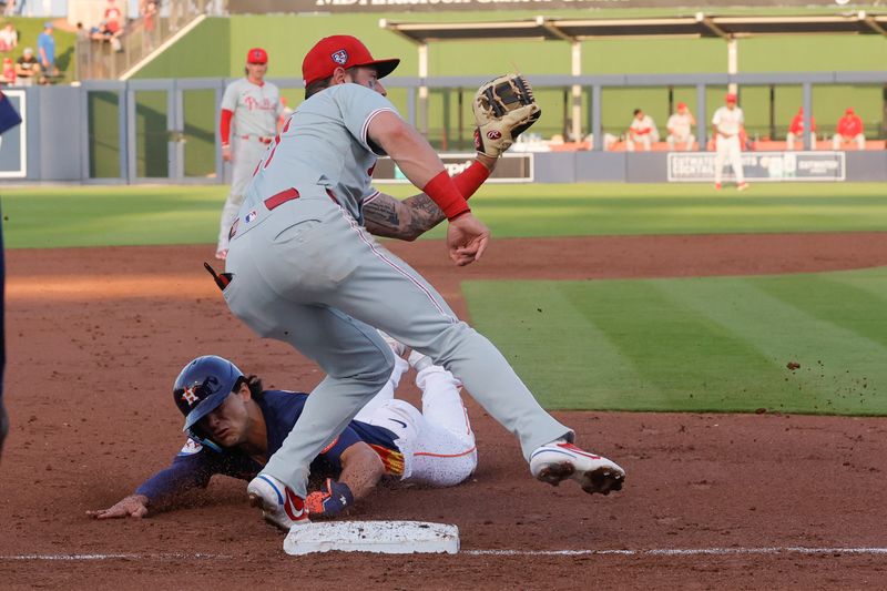 Mar 15, 2024; West Palm Beach, Florida, USA; Houston Astros center fielder Joey Loperfido steals third base as Philadelphia Phillies third baseman Weston Wilson (37) covers the base during the third inning at The Ballpark of the Palm Beaches. Mandatory Credit: Reinhold Matay-USA TODAY Sports