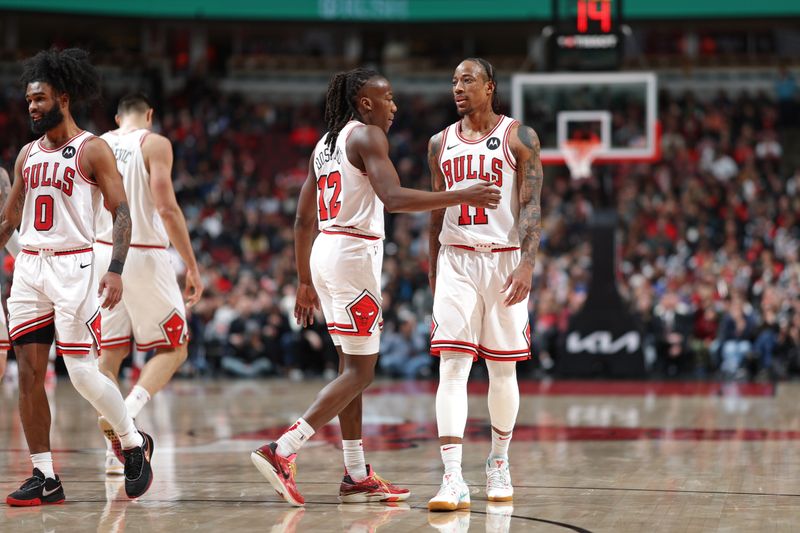 CHICAGO, IL - FEBRUARY 28: Ayo Dosunmu #12 and DeMar DeRozan #11 of the Chicago Bulls high five during the game against the Cleveland Cavaliers on February 28, 2024 at United Center in Chicago, Illinois. NOTE TO USER: User expressly acknowledges and agrees that, by downloading and or using this photograph, User is consenting to the terms and conditions of the Getty Images License Agreement. Mandatory Copyright Notice: Copyright 2024 NBAE (Photo by Jeff Haynes/NBAE via Getty Images)