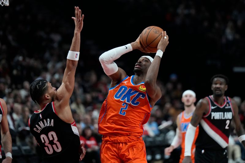 PORTLAND, OREGON - NOVEMBER 01: Shai Gilgeous-Alexander #2 of the Oklahoma City Thunder shoots the ball against Toumani Camara #33 of the Portland Trail Blazers during the second half at Moda Center on November 01, 2024 in Portland, Oregon. NOTE TO USER: User expressly acknowledges and agrees that, by downloading and or using this photograph, User is consenting to the terms and conditions of the Getty Images License Agreement. (Photo by Soobum Im/Getty Images)