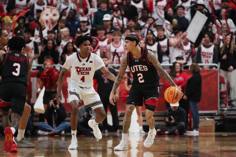 Jan 14, 2026; Lubbock, Texas, USA;  Utah Utes guard Terrence Brown (2) dribbles the ball against Texas Tech Red Raiders guard Christian Anderson (4) in the second half at United Supermarkets Arena. Mandatory Credit: Michael C. Johnson-Imagn Images