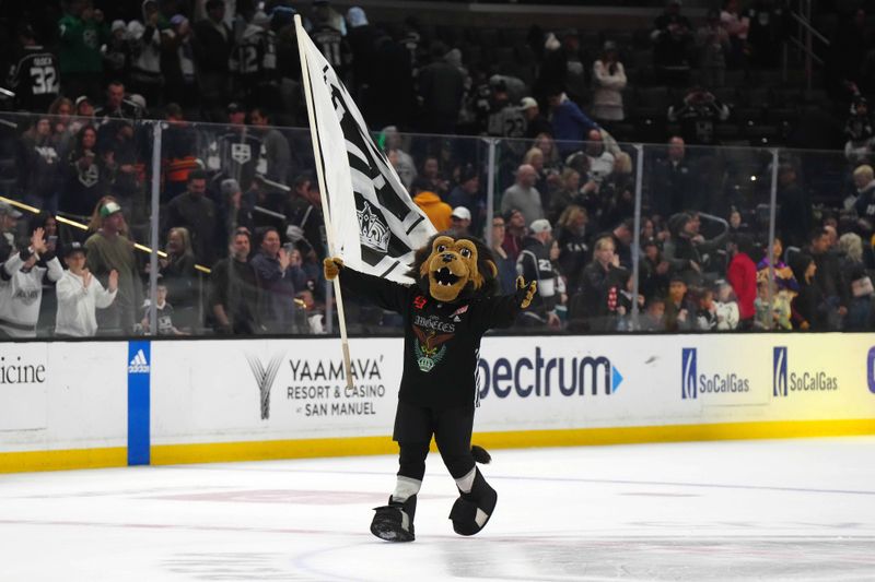 Apr 13, 2024; Los Angeles, California, USA; LA Kings mascot Bailey waves a flag after the game against the Anaheim Ducks at Crypto.com Arena. Mandatory Credit: Kirby Lee-USA TODAY Sports