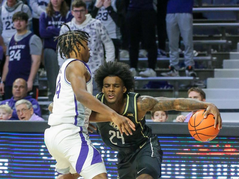 Jan 6, 2024; Manhattan, Kansas, USA; UCF Knights guard Jaylin Sellers (24) is guarded by Kansas State Wildcats guard Dai Dai Ames (4) during the second half at Bramlage Coliseum. Mandatory Credit: Scott Sewell-USA TODAY Sports