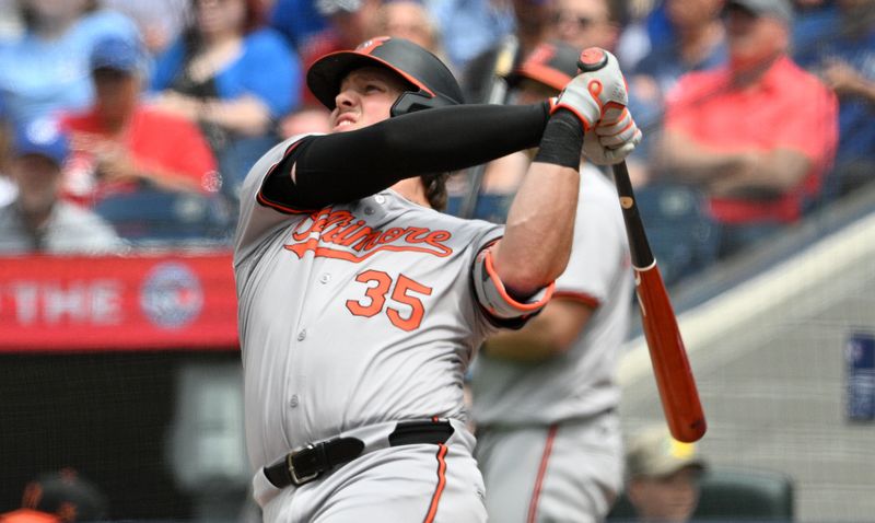 Jun 6, 2024; Toronto, Ontario, CAN;  Baltimore Orioles designated hitter Adley Rutschman (35) hits a solo home run against the Toronto Blue Jays in the sixth inning at Rogers Centre. Mandatory Credit: Dan Hamilton-USA TODAY Sports