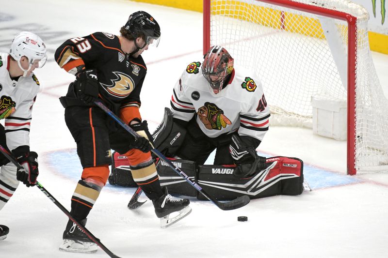 Mar 21, 2024; Anaheim, California, USA; Chicago Blackhawks goaltender Arvid Soderblom (40) makes a save off a shot by Anaheim Ducks center Mason McTavish (23) in the first period at Honda Center. Mandatory Credit: Jayne Kamin-Oncea-USA TODAY Sports