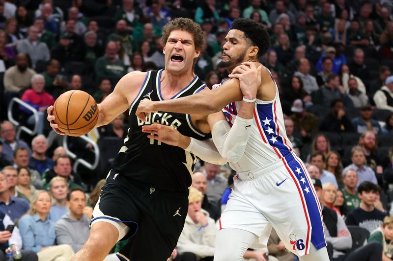 MILWAUKEE, WISCONSIN - MARCH 14: Brook Lopez #11 of the Milwaukee Bucks drives around Tobias Harris #12 of the Philadelphia 76ers during the first half of a game at Fiserv Forum on March 14, 2024 in Milwaukee, Wisconsin. NOTE TO USER: User expressly acknowledges and agrees that, by downloading and or using this photograph, User is consenting to the terms and conditions of the Getty Images License Agreement. (Photo by Stacy Revere/Getty Images)