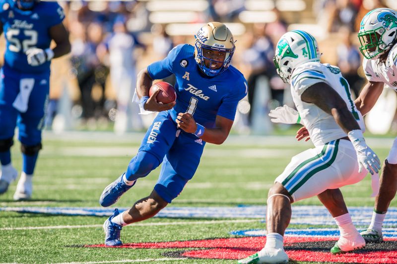 Nov 5, 2022; Tulsa, Oklahoma, USA;  Tulsa Golden Hurricane quarterback Braylon Braxton (1) runs the ball as Tulane Green Wave linebacker Nick Anderson (1) closes in during the first quarter at Skelly Field at H.A. Chapman Stadium. Tulane won 27-13. Mandatory Credit: Brett Rojo-USA TODAY Sports