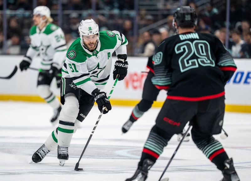 Nov 26, 2025; Seattle, Washington, USA; Dallas Stars forward Tyler Seguin (91) skates against Seattle Kraken defenseman Vince Dunn (29) during the first period at Climate Pledge Arena. Mandatory Credit: Stephen Brashear-Imagn Images