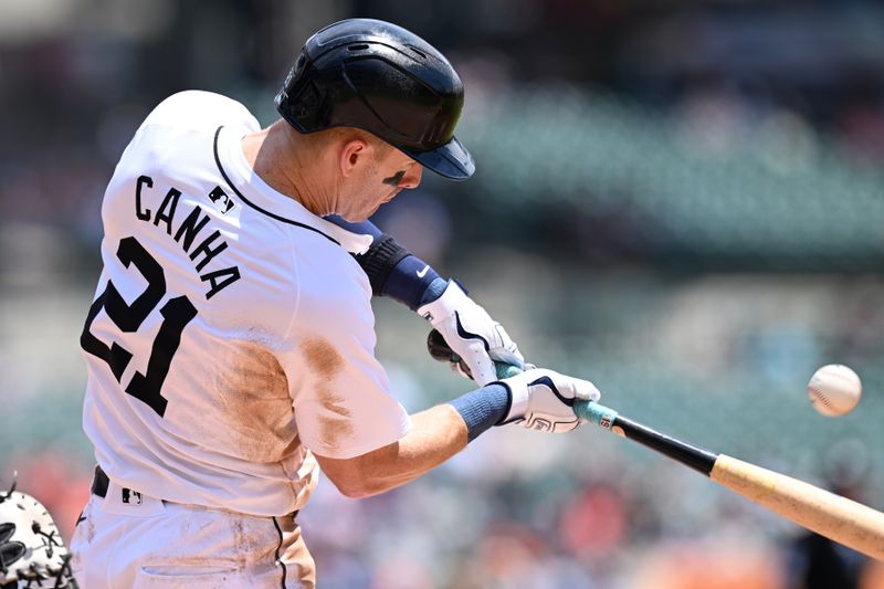Jun 13, 2024; Detroit, Michigan, USA;  Detroit Tigers first baseman Mark Canha (21) hits an RBI single against the Washington Nationals in the third inning at Comerica Park. Mandatory Credit: Lon Horwedel-USA TODAY Sports